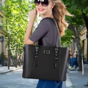 Sac ordinateur femme 17 pouces noir élégant porté à l’épaule en ville, style professionnel